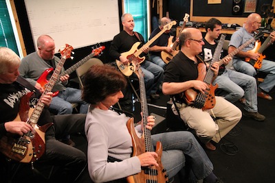 A group of bassists working on cycle patterns