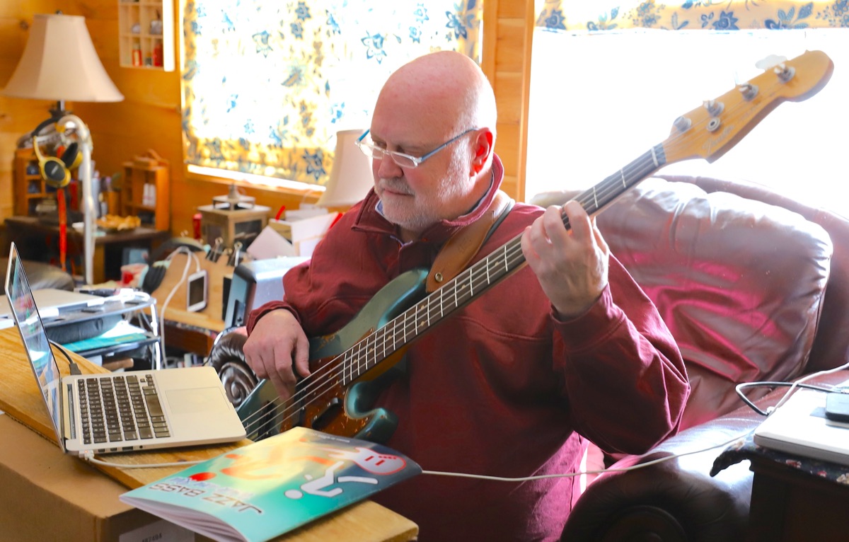 Jim Stinnett recording at home with his bass